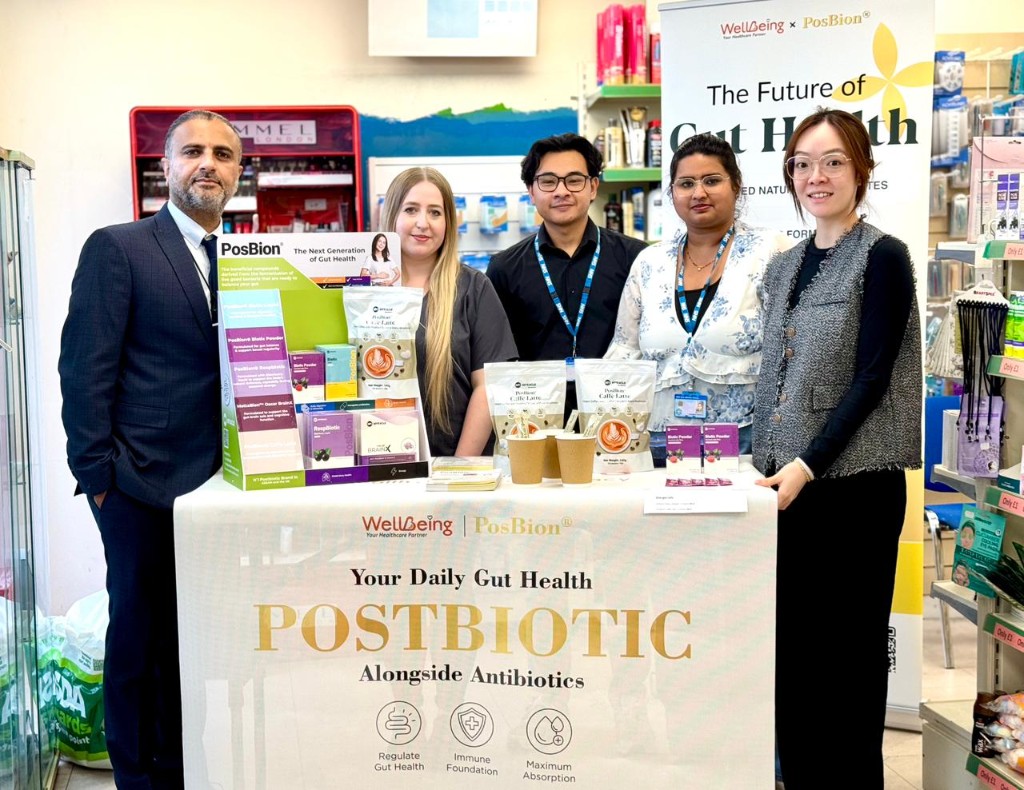 Pharmacy team gathered around the PosBion gut health display